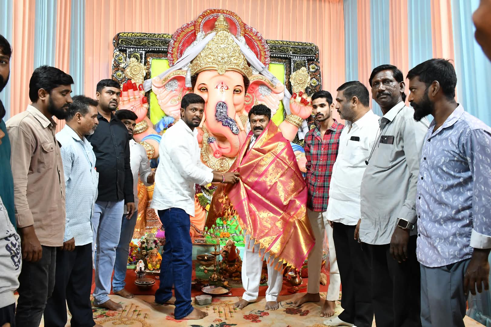 MLA Talasani Srinivas Yadav visits Ganesh pandals on a two-wheeler