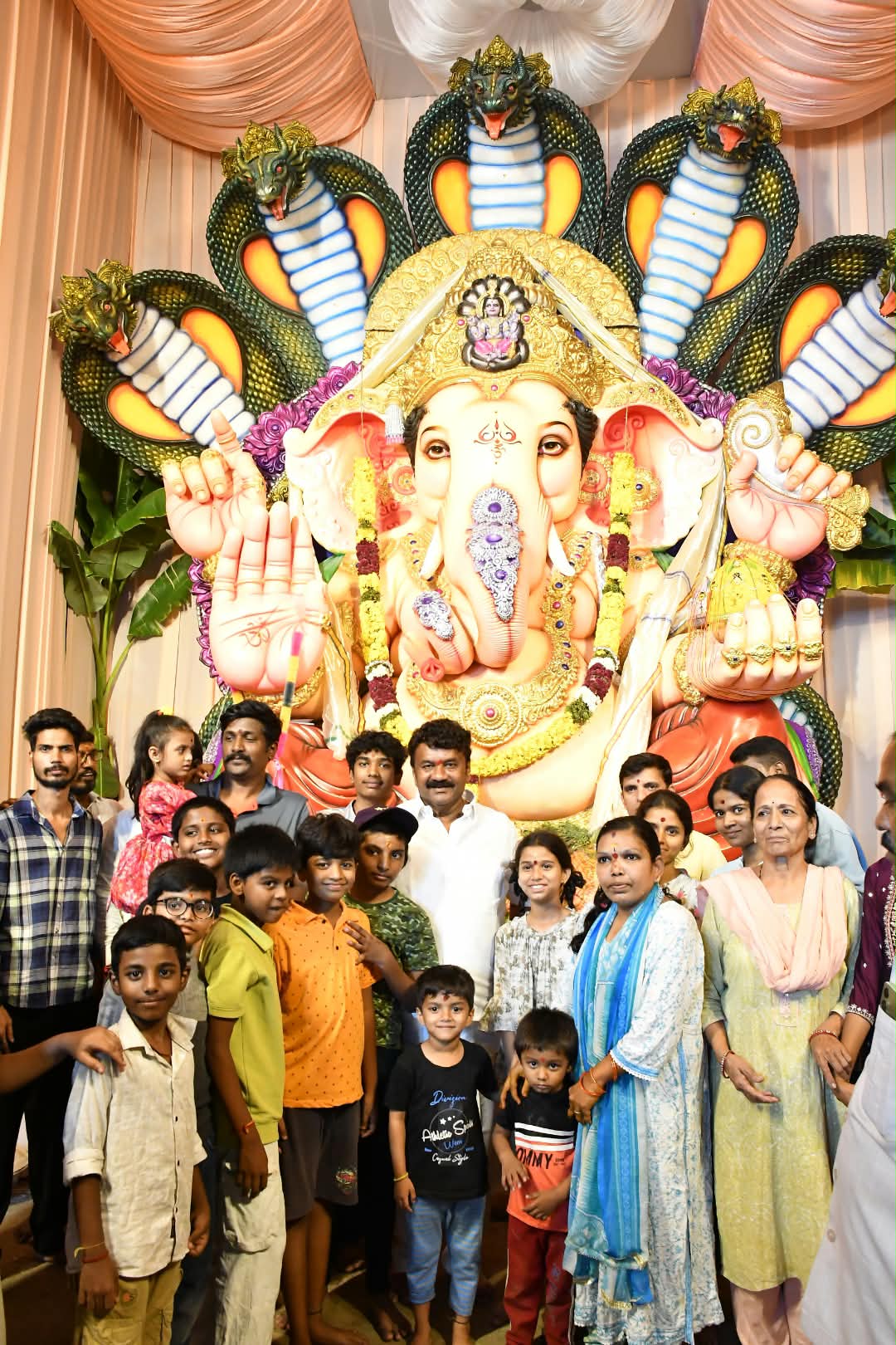 Former Minister Talasani Srinivas Yadav visits Ganesh Pandals on a Two-Wheeler